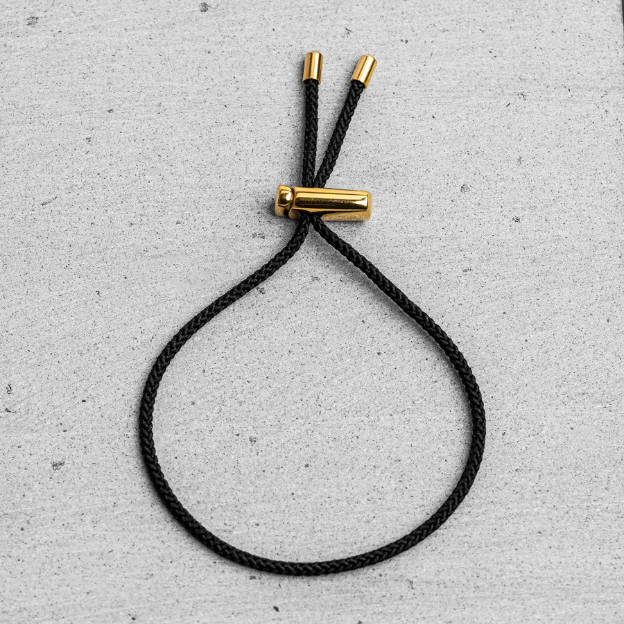 Our Black & Gold Drawstring Bracelet has been crafted using the finest braided maritime grade nylon rope.